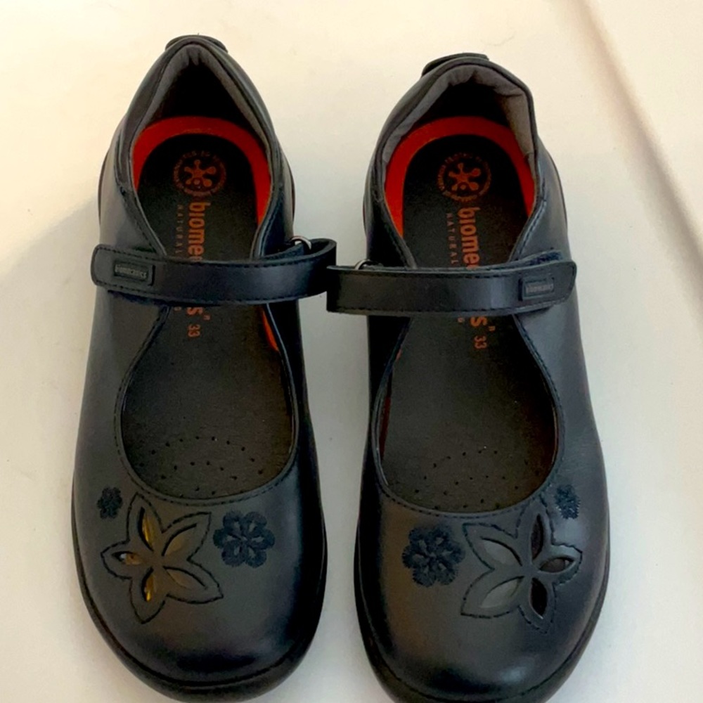 New blue school shoe with flower